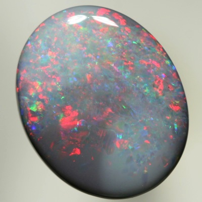 SOLID SEMI BLACK OPAL Red sparkles move over green and purple